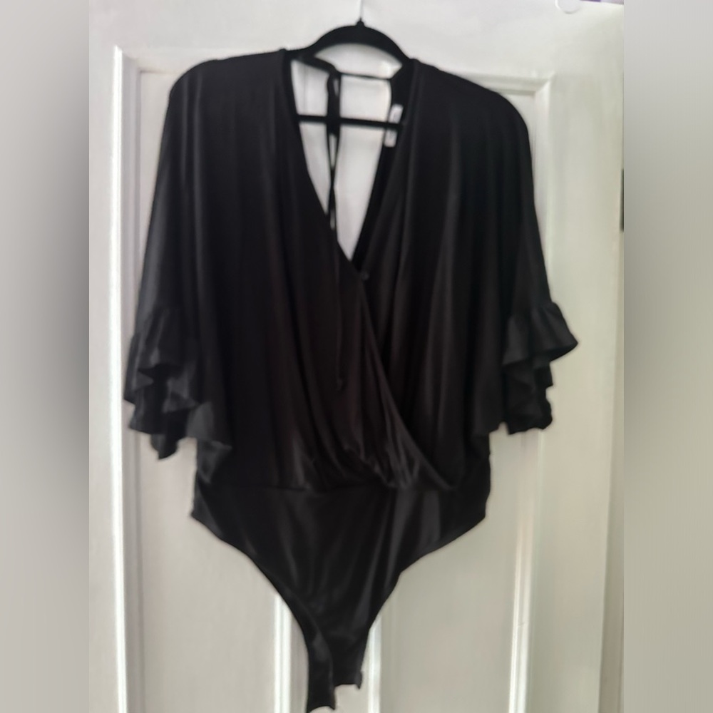 Never worn White Birch black body suit. Size large